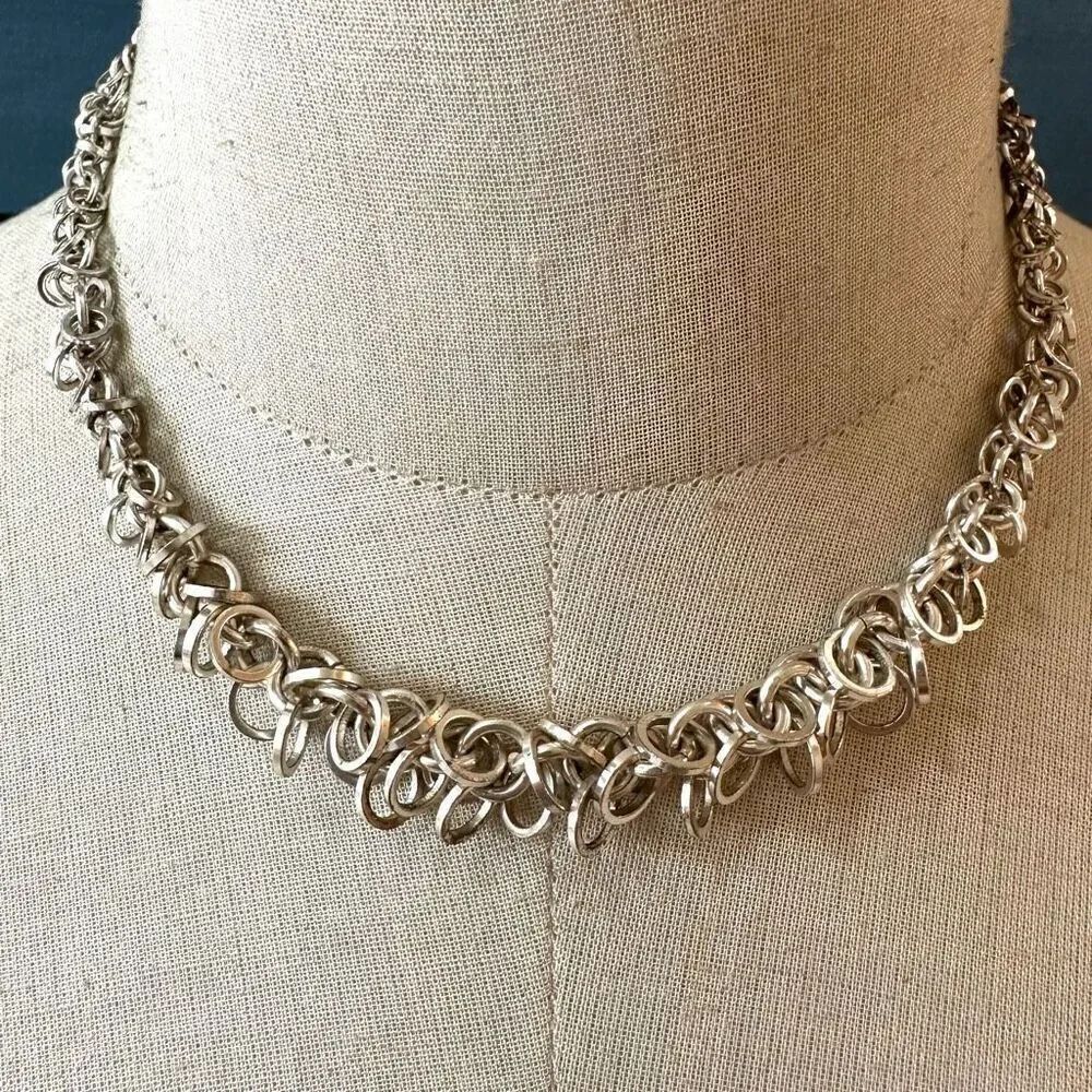 Avon silver tone multi ring necklace